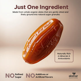 AKSHAR Ayurveda Date Sugar on a spoon over a jar ready for desserts.
