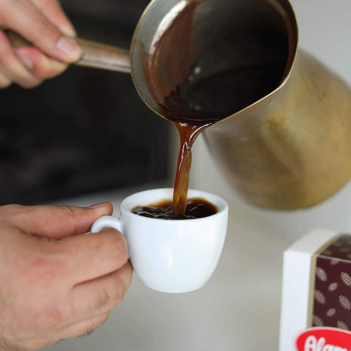 Steaming cup of Turkish coffee using Al Ameed, inviting warm sensory experience.