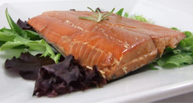 Alaska Smokehouse alder-smoked salmon close-up, showcases delicate texture and natural color.