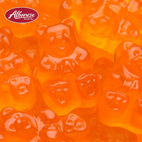 Assorted Albanese gummies including orange bears for a fruity snacking variety.