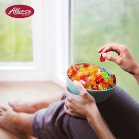 Albanese World's Best 5 Natural Flavor Gummi Bears on a serving plate for sharing.