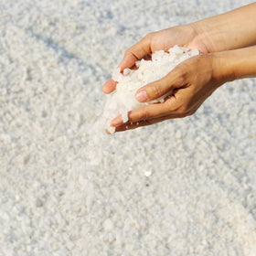 Close-up of Alebrixes Colima Sea Salt granules for mineral-rich flavor.