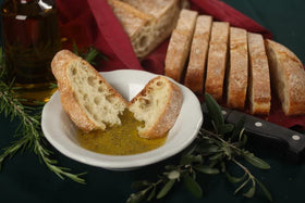 Alessi dipping spices on bread illustrate versatile olive oil pairing.