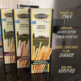 Alessi Sesame Breadsticks boxes opened to reveal thin sesame sticks.
