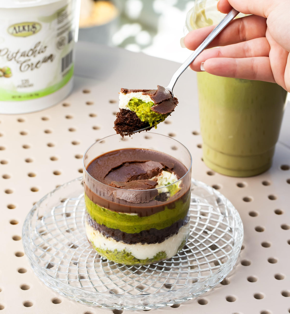 Alkis Pistachio Cream drizzled on a Dubai chocolate bar.