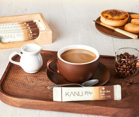 Alliving Kanu latte cup with foam showcasing the smooth sweetness.