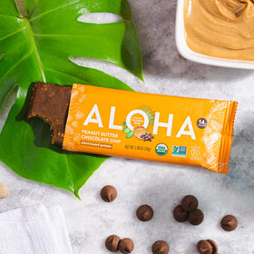 ALOHA organic pumpkin seed protein bar close-up highlighting plant-based protein