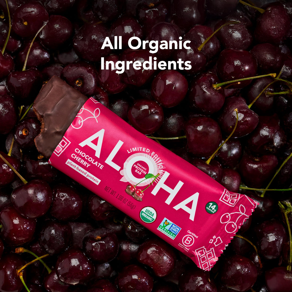 Unwrapped ALOHA Chocolate Cherry bar showing chewy texture and dark chocolate