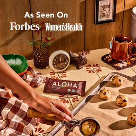 Cross-section reveals chips, cashew butter, and smooth texture of the ALOHA bar