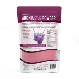 Alovitox Aronia Berry Powder being poured into water for a quick juice