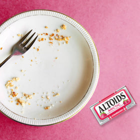 ALTOIDS Arctic Strawberry tin on a desk for instant breath confidence.