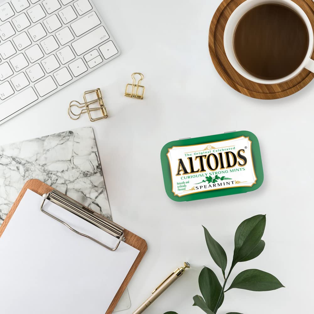 Altoids Spearmint pack on desk highlights everyday carry for quick refresh during the day.