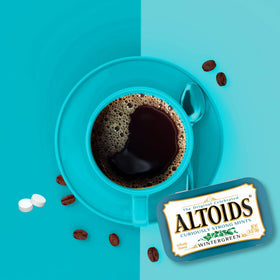 Altoids Wintergreen mint packs inside tin for on-the-go refreshment.
