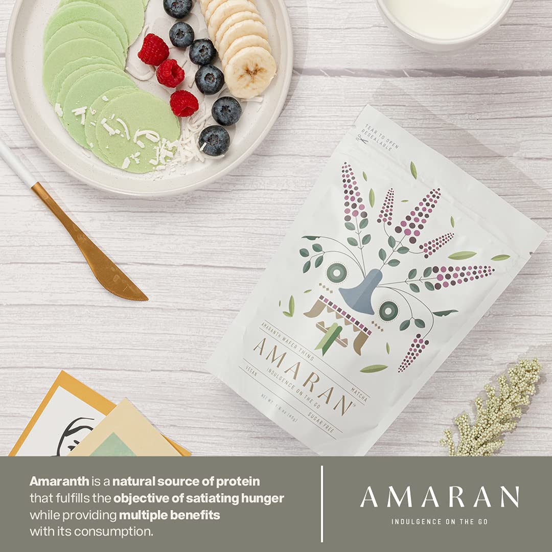 AMARAN Organic Amaranth Wafer Thins on wooden board with fruit for fresh snacking.