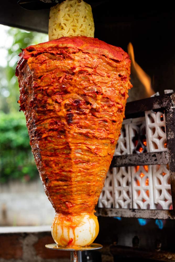 Achiote powder adds color to soups and stews in warm tones.