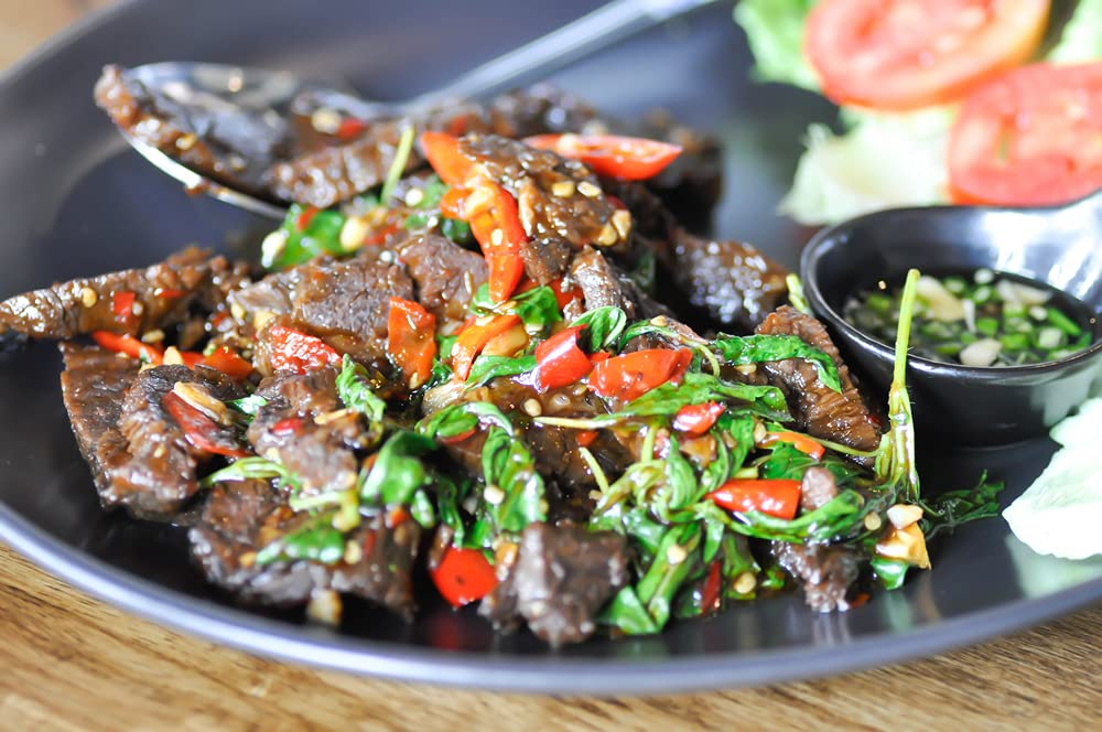 Amazing Chiles Sichuan chili flakes over marinated meat for balanced heat.