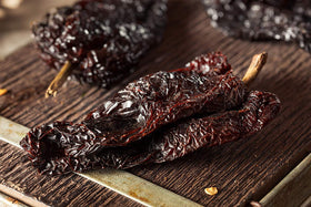 Amazing Chiles & Spices ancho powder sauce simmer adding depth and smokiness.