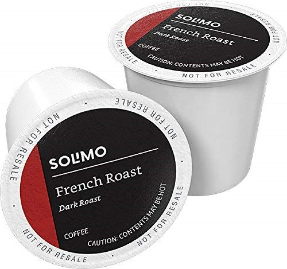 Amazon Brand Solimo dark roast French Roast coffee pods on kitchen counter for bold morning brew.