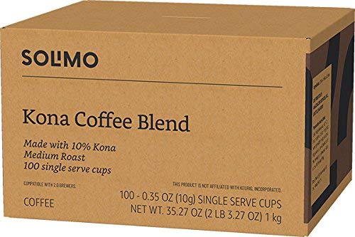 Solimo Kona Blend pods beside Keurig brewer demonstrates quick, compatible brewing.