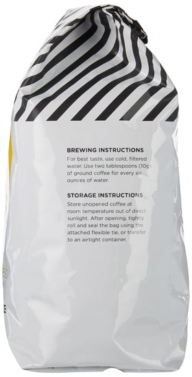 Amazon Fresh Just Bright coffee beans in a bin ready to grind for a balanced cup