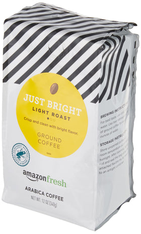 Amazon Fresh Just Bright bag closeup highlights 100% Arabica quality.