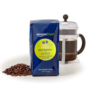 Amazon Fresh Peru coffee roasted beans closeup highlights fragrant notes for rich aroma.
