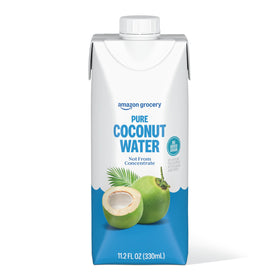 Pouring Amazon Grocery Pure Coconut Water bottle shows natural flavor