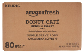 Close-up of Donut Café pods highlighting premium Arabica beans for balanced flavor.