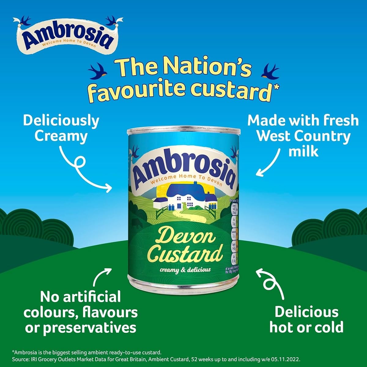 Pouring Ambrosia Devon Custard into a dessert bowl for a creamy finish.