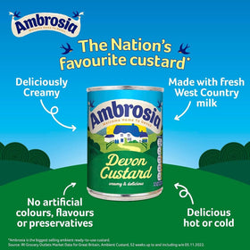 Pouring Ambrosia Devon Custard into a dessert bowl for a creamy finish.