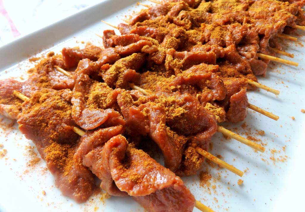 Aminchi Foods Suya seasoning on steak enhances spicy profile for seared meat.