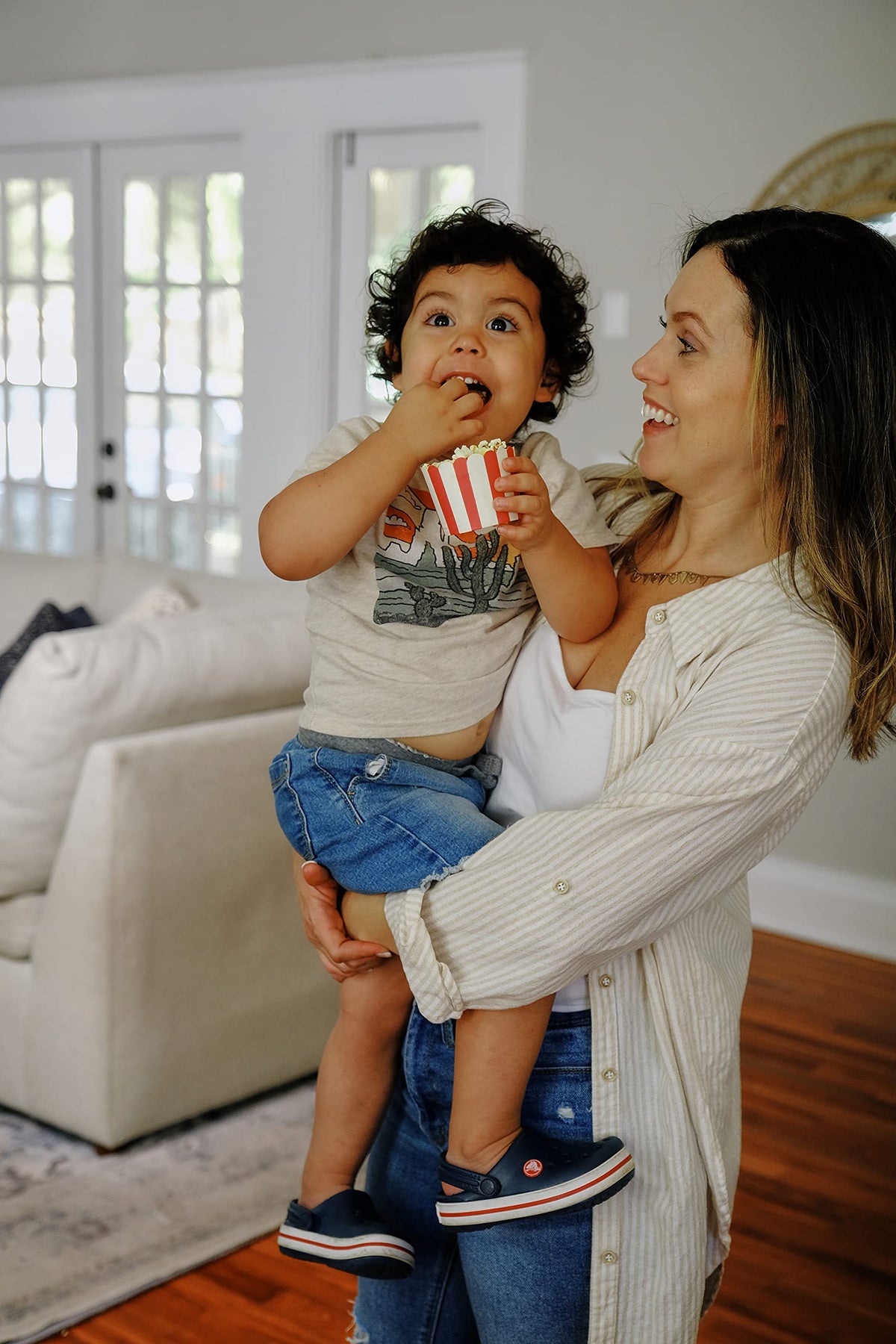 Bag open with kernels spilling onto a bowl ready to pop.
