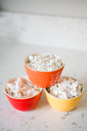 Amish Country Popcorn bowl with kernels, ideal for a cozy movie night.
