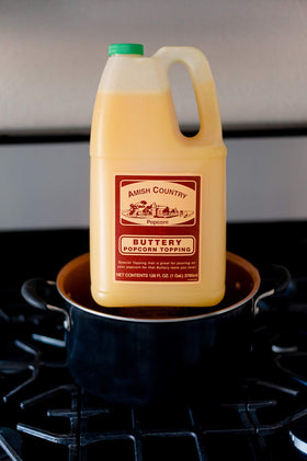 Popcorn bowl with Amish Country Popcorn Buttery Topping creating a glossy coating.