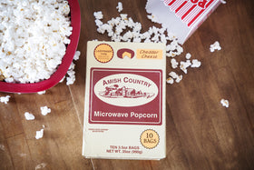 Cheddar cheese flavor close-up on Amish Country Popcorn ladyfinger kernels.