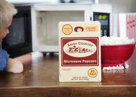 Low-calorie snack option featuring Amish Country Popcorn cheddar flavor.