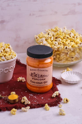 Amish Country Popcorn coconut oil glass bottle on kitchen counter