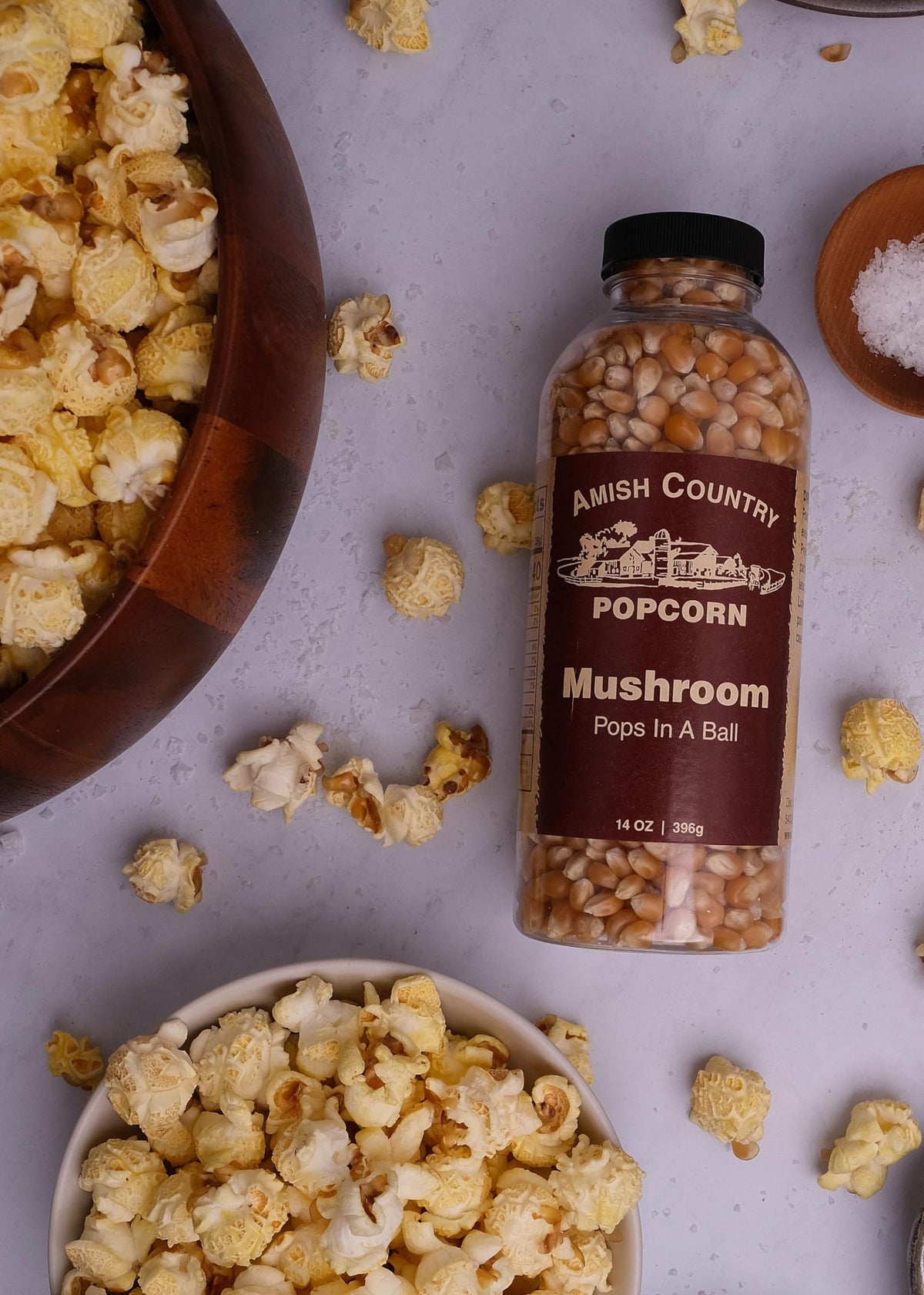 Amish Country Popcorn mushroom kernel bottle pouring for movie night