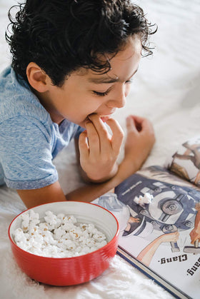 Amish Country Popcorn non-GMO gluten-free badge highlights safe snacking.