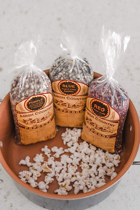 Three-pack of Amish Country Popcorn bags for easy sharing