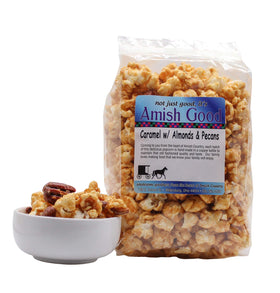 Amish Good caramel popcorn served in a bowl with nuts and caramel coating