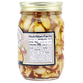 Amish Wedding hot pickled garlic close-up showing brine and peppery slices