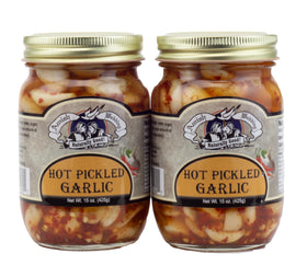 Amish Wedding hot pickled garlic jars on rustic board showcasing bold flavor
