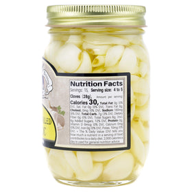 Amish Wedding hot and sweet pickled garlic brine pour, inviting tangy flavor in dishes.