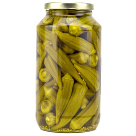 Two Amish Wedding jars with brine visible in a rustic kitchen.