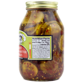 Jar close-up of Amish Wedding Zesty Bread N Butter Pickles shows crisp cucumbers and peppers for bold snacking.