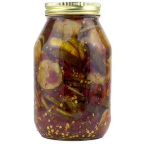 Served on a plate with cheese, Amish Wedding Zesty Bread N Butter Pickles offer savory snack variety.