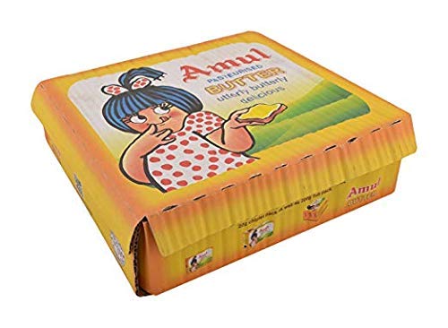 AMUL Butter 8g pack on a kitchen counter, ideal for quick, flavorful spreads.