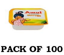 AMUL butter on toast being spread, a creamy addition for breakfast.
