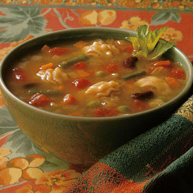 Opened Amy's Minestrone can with a spoon, ready for a quick vegan dinner.